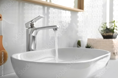 Stylish white sink in modern bathroom interior photo