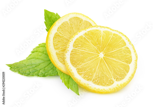 Isolated lemon and mint. Two pieces of lemon fruit and fresh mint leaves isolated on white background with clipping path