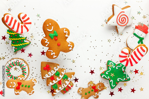 Christmas holiday background with gingerbread cookies flying in motion. Winter or Christmas festive concept. Flat lay, copy space.