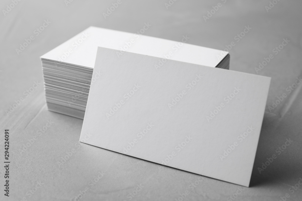 Stack of empty sheets on grey stone table. Mock up for design Stack of empty sheets on grey stone table. Mock up for design