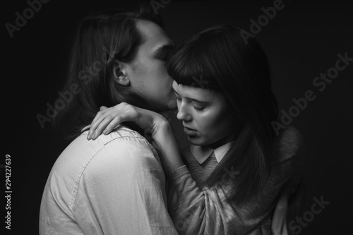 Portrait of young beautiful couple. Black and white. Low key