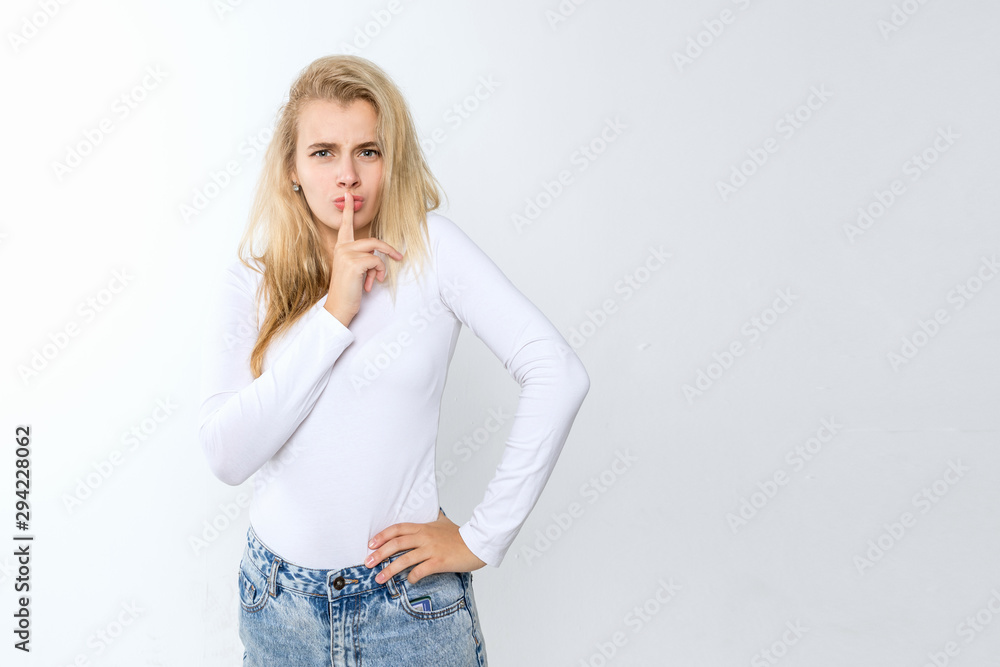 Young blonde female posing on a white background Young blonde female posing on a white background