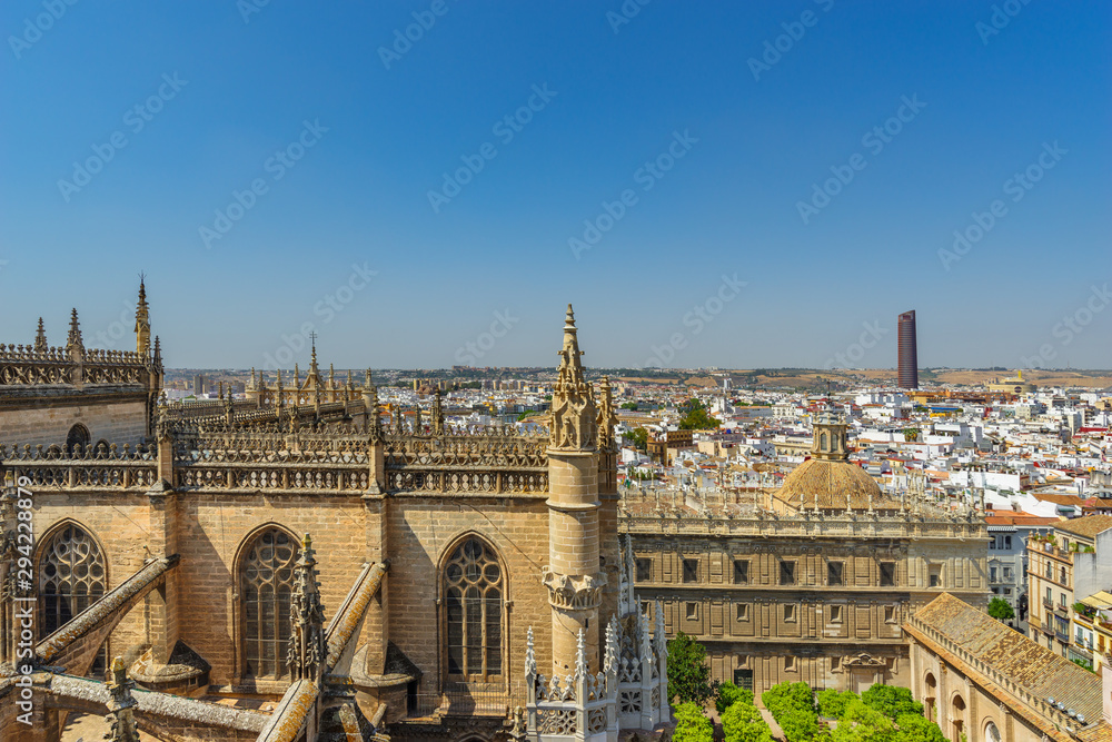 The view of Seville from the height of the Giralda tower of Cathedral on a sunny day.