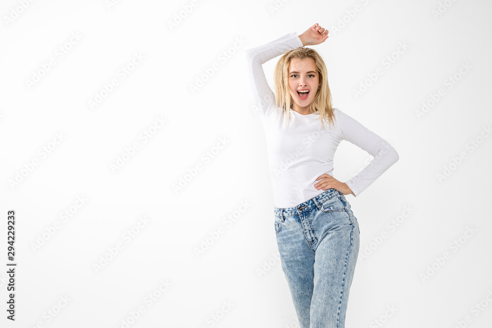 Young blonde female posing on a white background Young blonde female posing on a white background