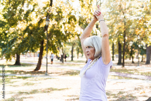 Senior woman exercising at park
