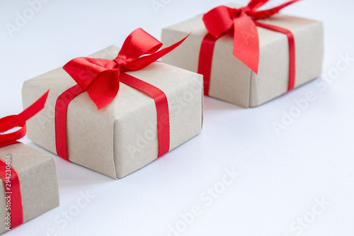 brown gift box with red ribbon on white background top view for christmas or celebrate © sattawat