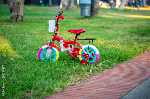 Child colorful bicycle with training wheels