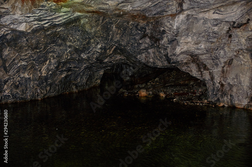 Underground Grotto Panorama.Types of a former underground marble quarry flooded with water. The massive arches of the grotto and the texture of natural marble are visible. Russia  Karelia  Ruskeala