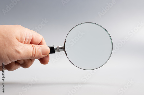 Hand with Magnifying Glass