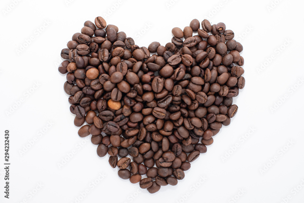 Heart made from coffee beans isolated on white background. Coffee shop concept Heart made from coffee beans isolated on white background. Coffee shop concept