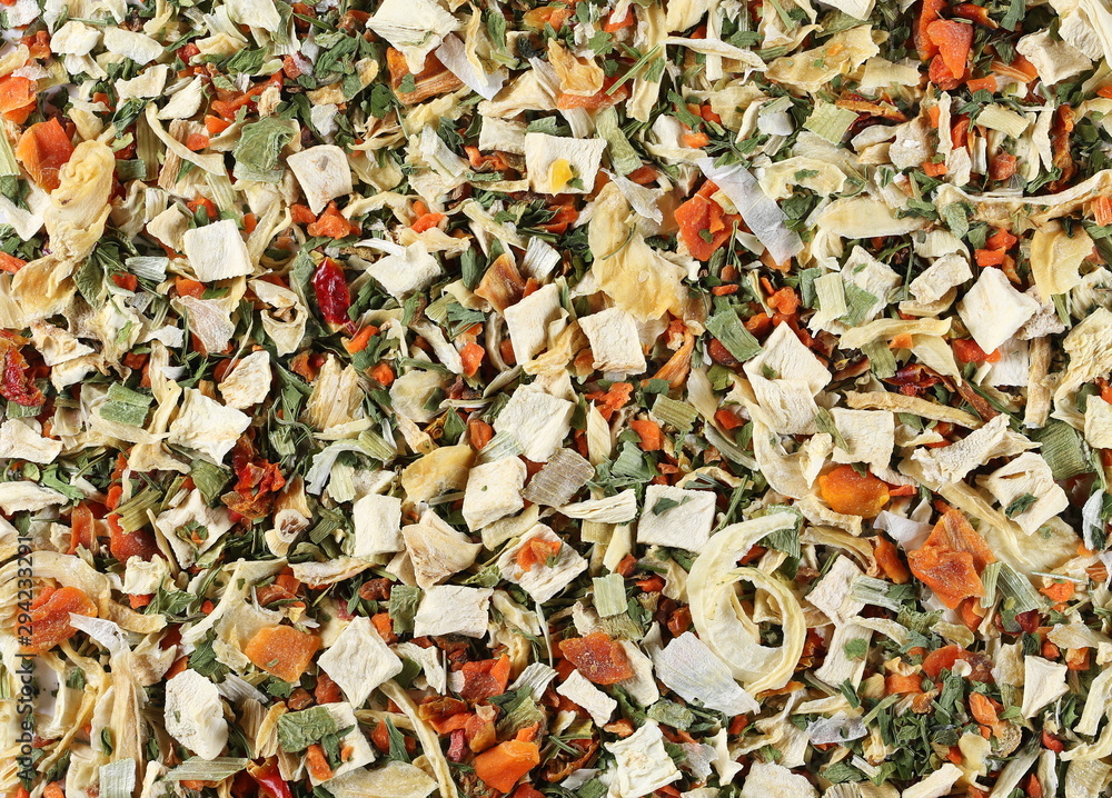 Dry cut and chopped up vegetables mix, spice background and texture, uncooked and top view Dry cut and chopped up vegetables mix, spice background and texture, uncooked and top view