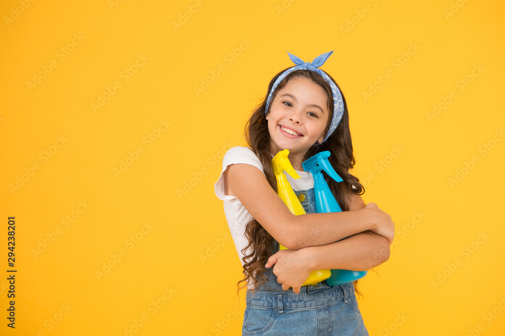 Cleaning products that work. Happy little girl enjoy doing house work. Cute small child ready for cleaning work. Clean home is our work, copy space Cleaning products that work. Happy little girl enjoy doing house work. Cute small child ready for cleaning work. Clean home is our work, copy space