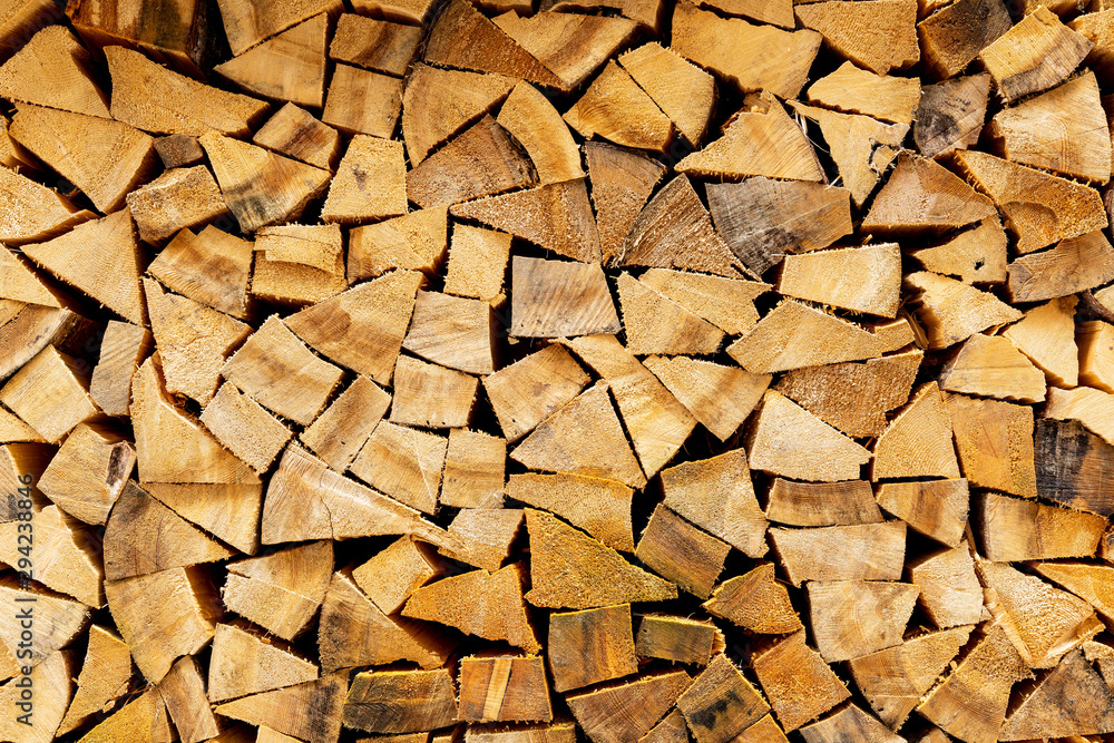 Woodpile in stack.Triangle shape. Wall of firewood Woodpile in stack.Triangle shape. Wall of firewood