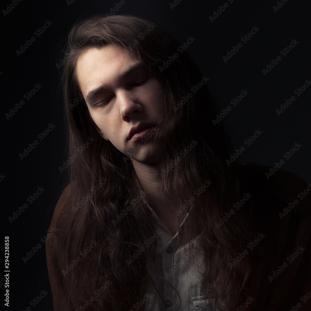 Portrait of adorable young man with eyes closed Portrait of adorable young man with eyes closed