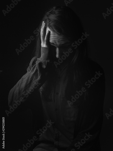 Portrait of young man in despair. Black and white.