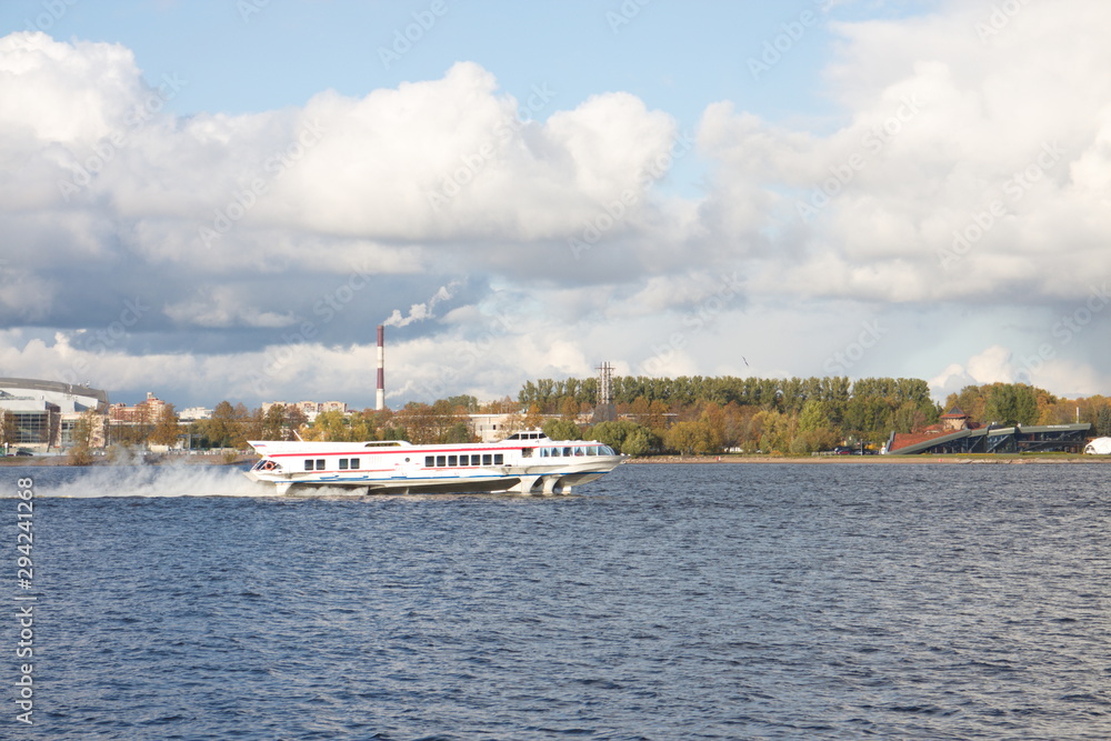 River landscape with boats on a sunny day River landscape with boats on a sunny day
