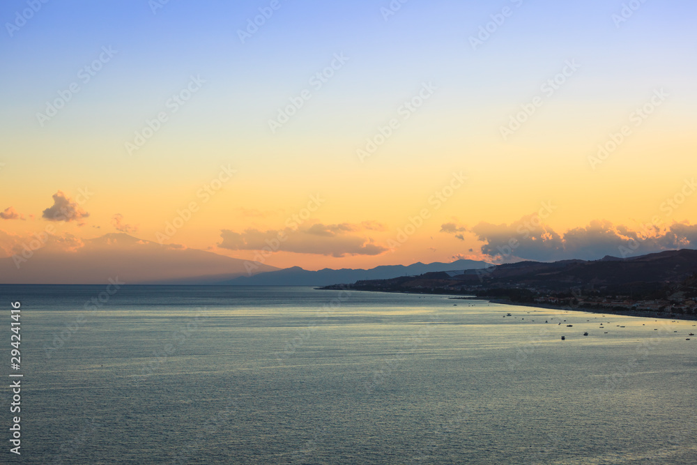 Spectacular sunset with view on Mt. Etna and Bova Marina coast in Calabria