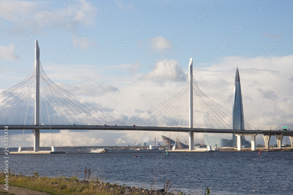 Obraz premium Cable-stayed bridge over a large river on a sunny day