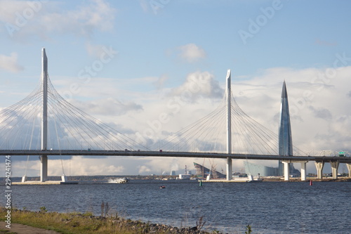 Cable-stayed bridge over a large river on a sunny day