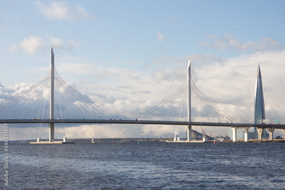 Cable-stayed bridge over a large river on a sunny day