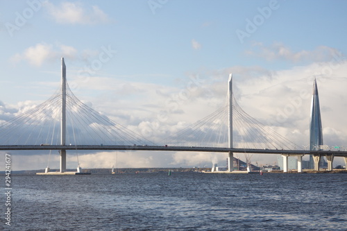 Cable-stayed bridge over a large river on a sunny day