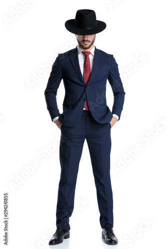 Confident businessman holding both hands in his pocket