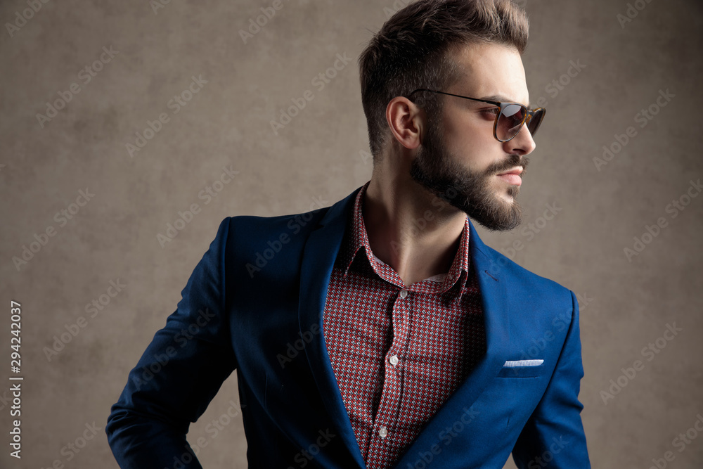 Fototapeta premium businessman standing and looking to a side pensive