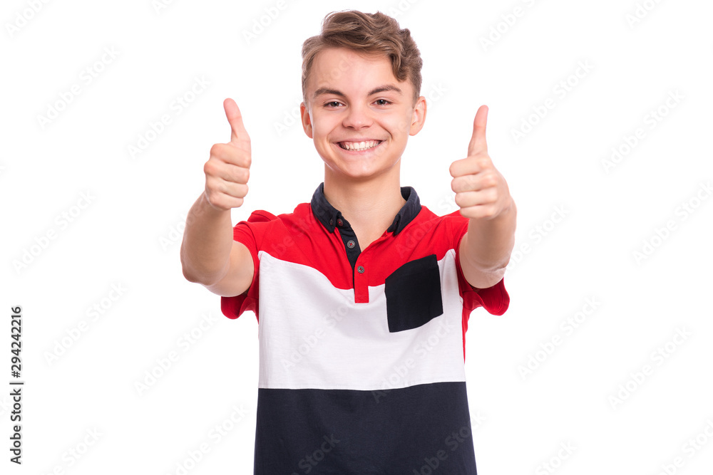 Portrait of teen boy making thumbs up gesture, isolated on white background. Handsome caucasian young teenager smiling and showing success sign. Happy cute child looking at camera. Portrait of teen boy making thumbs up gesture, isolated on white background. Handsome caucasian young teenager smiling and showing success sign. Happy cute child looking at camera.