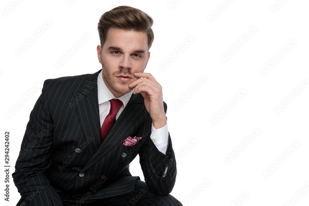 elegant young businessman wearing double breasted suit and red tie elegant young businessman wearing double breasted suit and red tie
