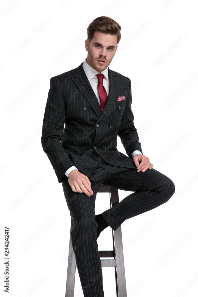 attractive young businessman wearing double breasted suit and red tie attractive young businessman wearing double breasted suit and red tie