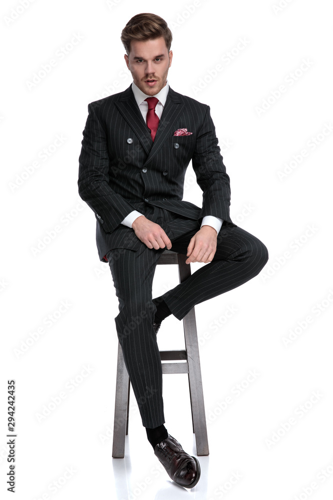young modern businessman wearing double breasted suit and red tie young modern businessman wearing double breasted suit and red tie