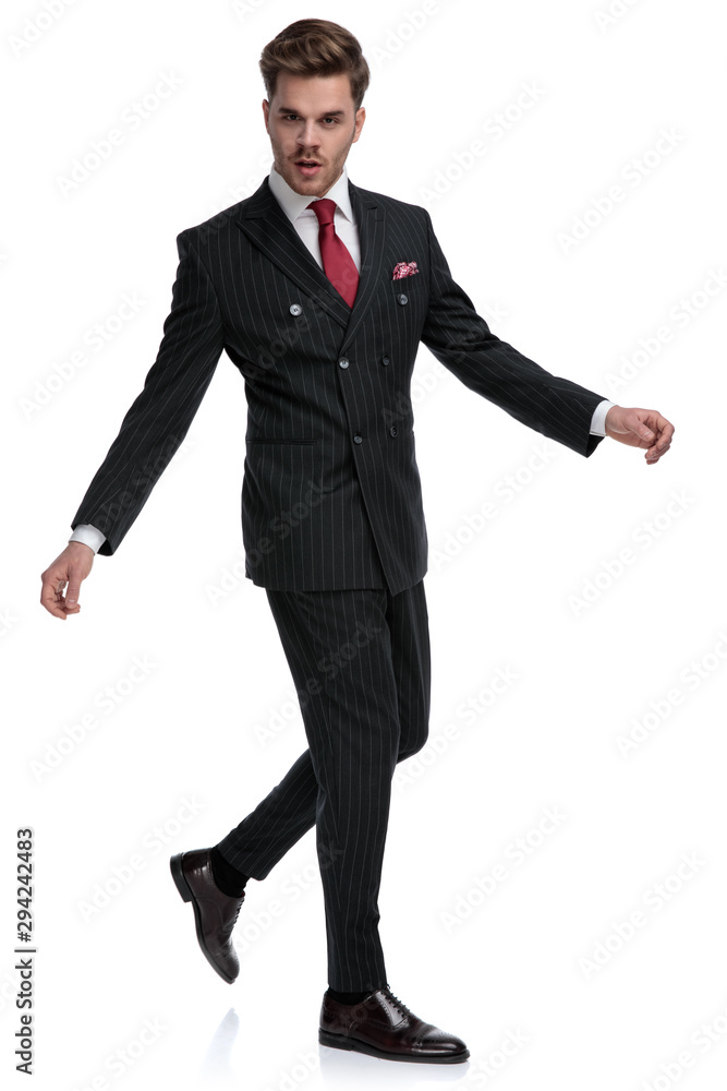 elegant young businessman wearing double breasted suit and brague shoes elegant young businessman wearing double breasted suit and brague shoes