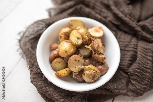 Delicious Roasted mini potato with spices and Parmesan cheese, cut in halves