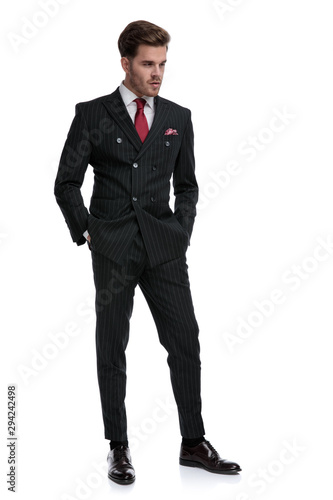 elegant businessman wearing double breasted suit and red tie