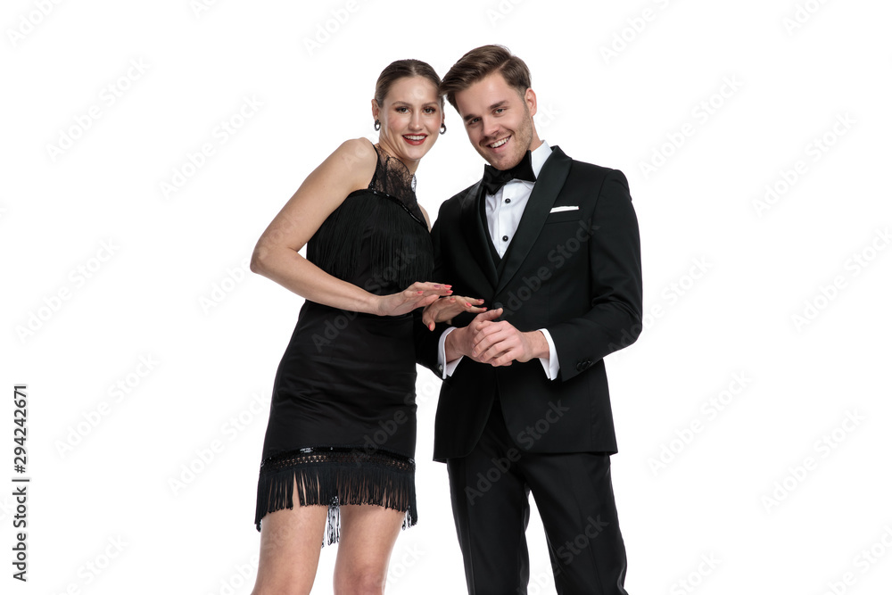 Happy couple smiling and posing together w Happy couple smiling and posing together w