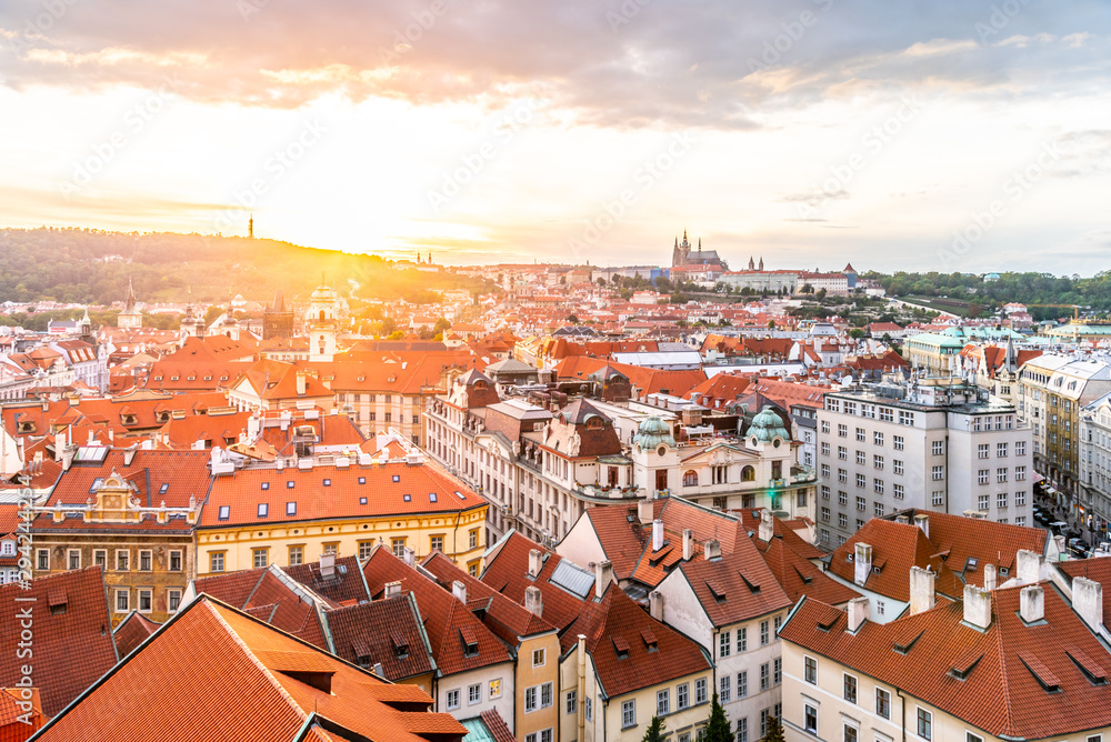 Evening sunset in Prague. Prague Castle illuminated by sun flare, Czech Republic Evening sunset in Prague. Prague Castle illuminated by sun flare, Czech Republic