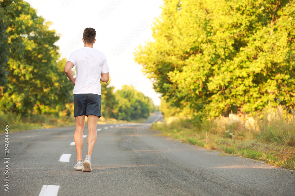 Sporty young man running outdoors Sporty young man running outdoors