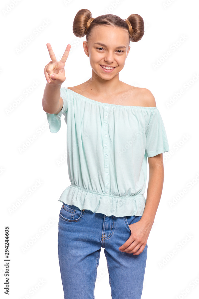 Portrait of successful teen girl winner making Victory Gesture, isolated on white background. Beautiful caucasian young teenager. Happy cute child showing success sign and looking at camera. Portrait of successful teen girl winner making Victory Gesture, isolated on white background. Beautiful caucasian young teenager. Happy cute child showing success sign and looking at camera.