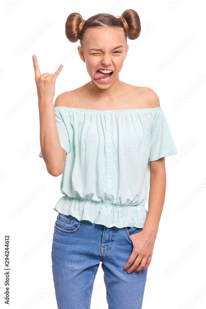 Crazy teen girl making Rock Gesture, isolated on white background. Funny teenager shows tongue and doing heavy metal rock sign. Problems of transitional age. Crazy teen girl making Rock Gesture, isolated on white background. Funny teenager shows tongue and doing heavy metal rock sign. Problems of transitional age.
