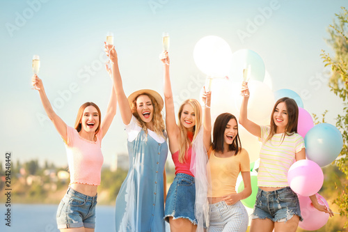 Beautiful young women drink...