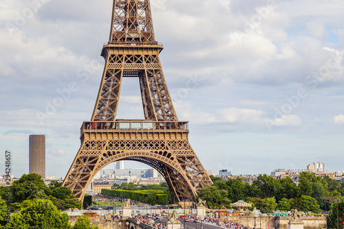 Shot of the Eiffel Tower in Paris France on a beautiful Spring day with blue sky and white clouds