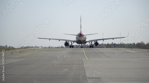 Plane ready for take off rolls on runway at airport. 4K