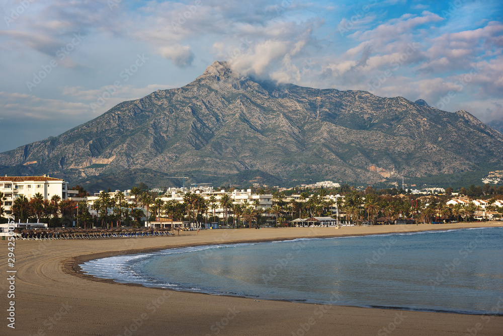 Sandy beach and mountain near Puerto Banus town, Andalusia, Spain