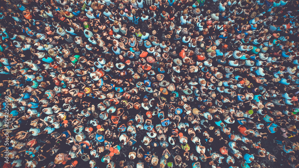 People crowd texture background. Bird eye view. Toned.