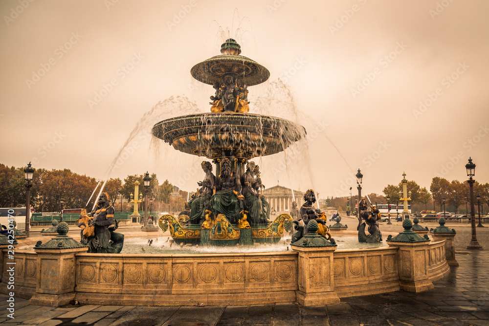 Fountain of River Commerce and Navigation in Place de la Concorde in Paris France, on a Fall day, with drops of water falling from the golden fountain