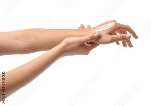 Female hands with cream on white background