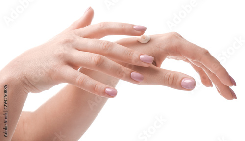 Female hands with cream on white background