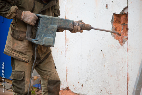 Jackhammer. The use of a jackhammer in construction works.