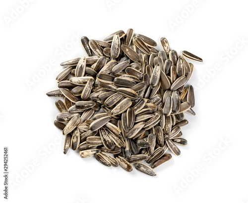 Pile of large striped sunflower seeds with shell isolated