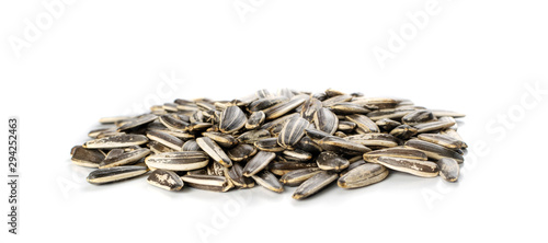 Pile of large striped sunflower seeds with shell isolated